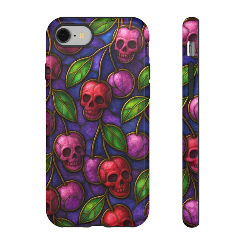 A protective phone case with a gothic cherry skull design featuring red and pink skulls blended with purple cherries and vibrant green leaves. The pattern is outlined in gold and set against a deep blue-purple stained glass background. The case has a smooth matte finish and fits various phone models with precision-cut camera openings.